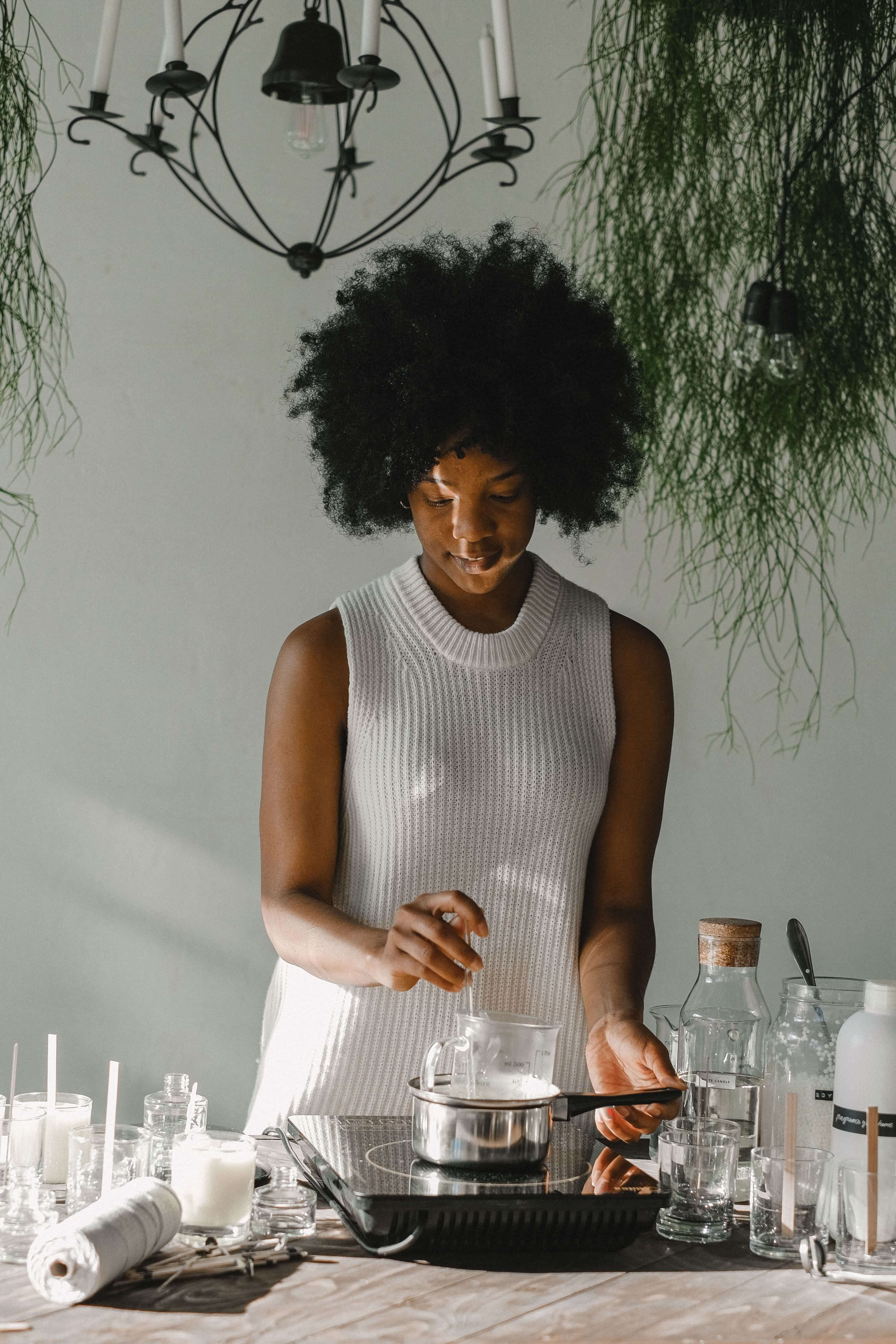 Young entrepreneur making candles for her business