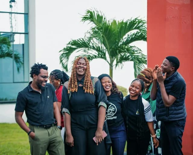 Group of happy teenagers smiling together outdoors